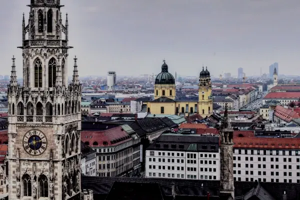 The tower of the Munich town hall above the rooftops of the old town