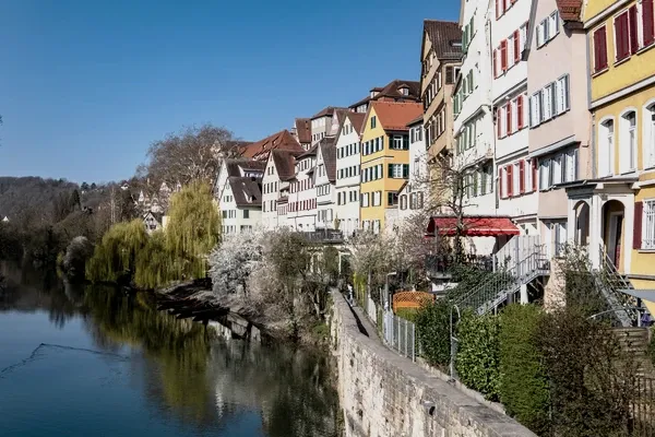 The painted houses of the Neckarfront in Tübingen, reflected in the river